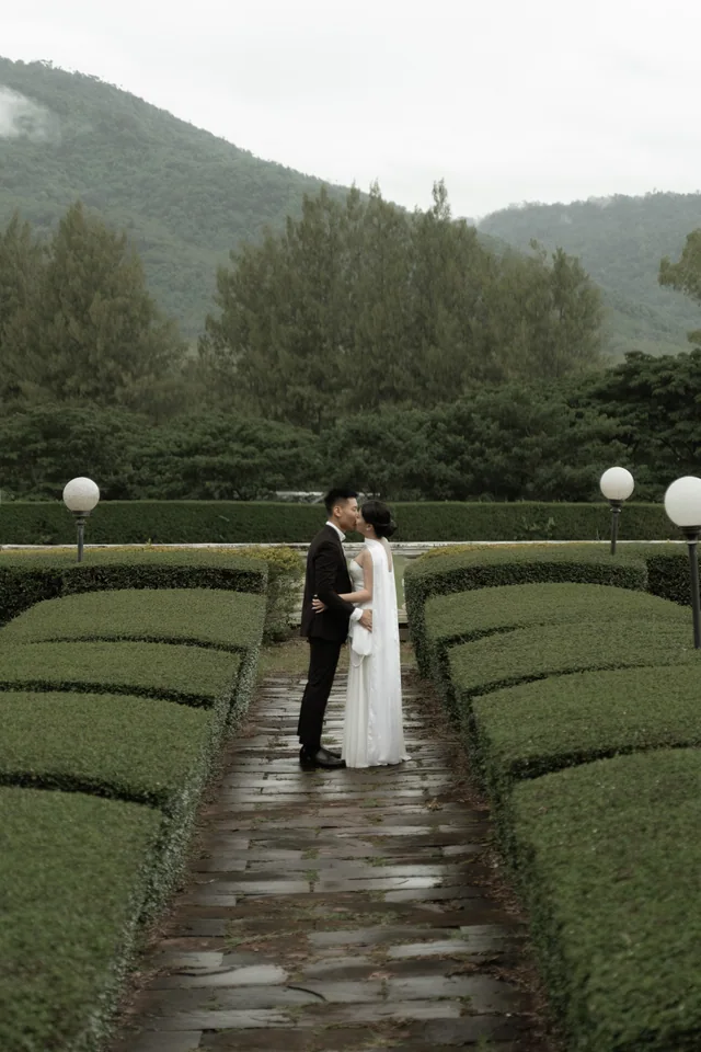Mauric and Nadya standing together in a lush garden
